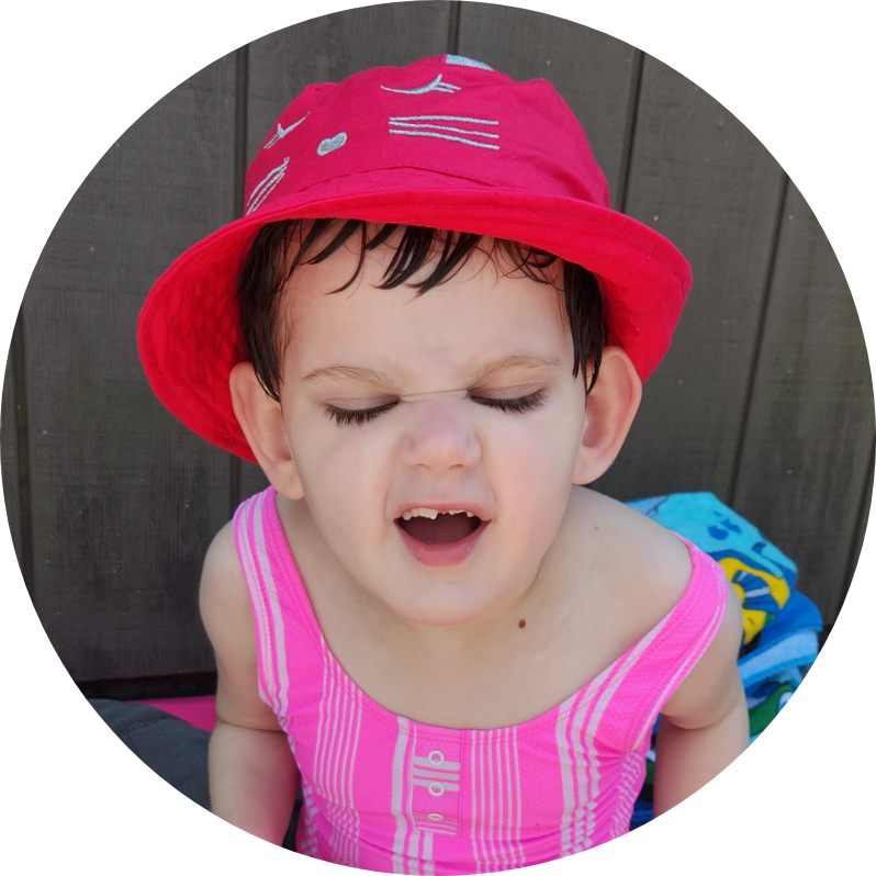 Lina outside wearing a red hat